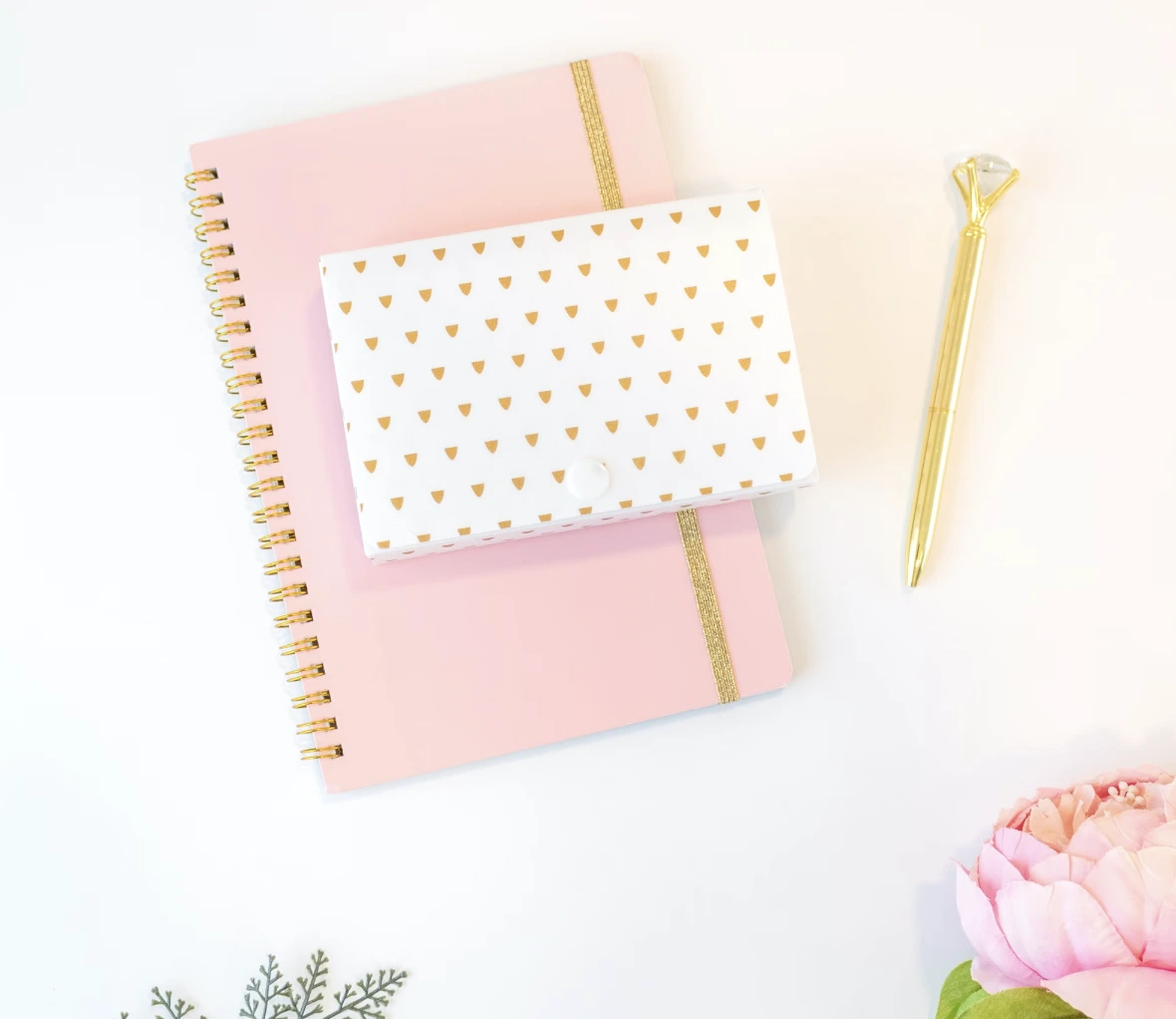 This image displays a photo with vibrant colors, including shades of pink, gold, and green.