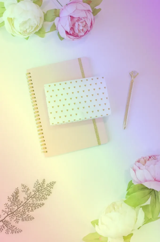 Utilizing the css overlay effect. This image shows a diary with a gold pen. It also shows some flowers scattered around. We set the background-image: linear-gradient(to bottom left,
rgba(148, 0, 211, 0.5), rgba(75, 0, 130, 0.3),
rgba(0, 0, 255, 0.2), rgba(0, 255, 0, 0.2),
rgba(255, 255, 0, 0.3), rgba(255, 127, 0, 0.3),
rgba(255, 0, 0, 0.3)
); and we add a rainbow effect.