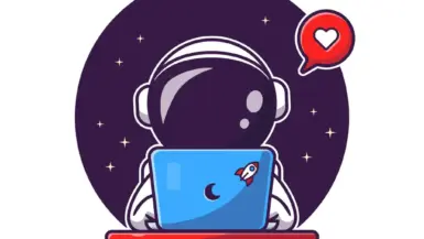 An astronaut typing in front of a laptop